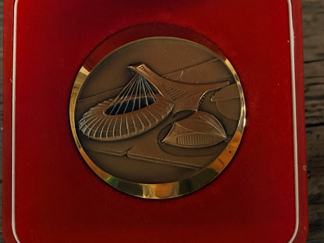 Official 1976 Montréal Olympics bronze medallion by Huguenin Switzerland with original red case and numbered COA #013824. Vintage Olympic collectible.