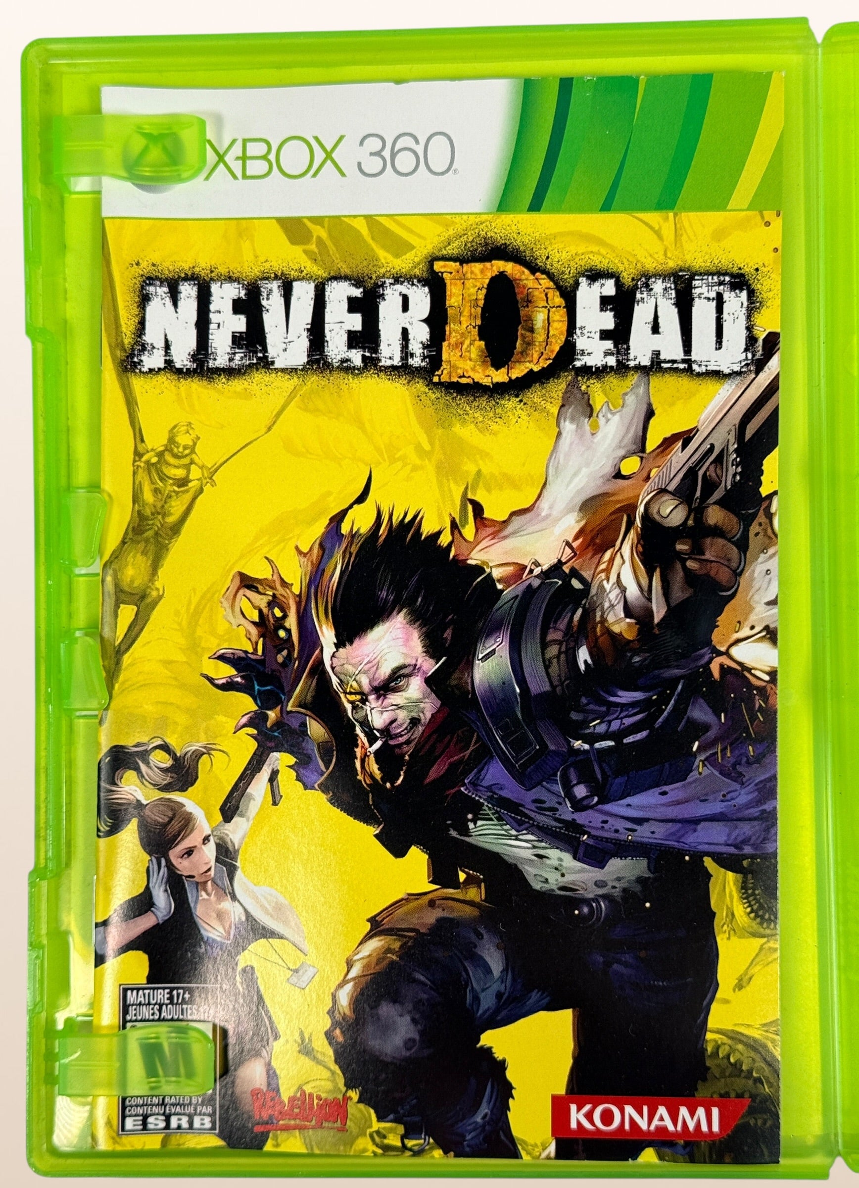 NeverDead for Xbox 360 by Konami. Cult action horror shooter with unique gameplay mechanics. Includes original case and disc in very good condition.