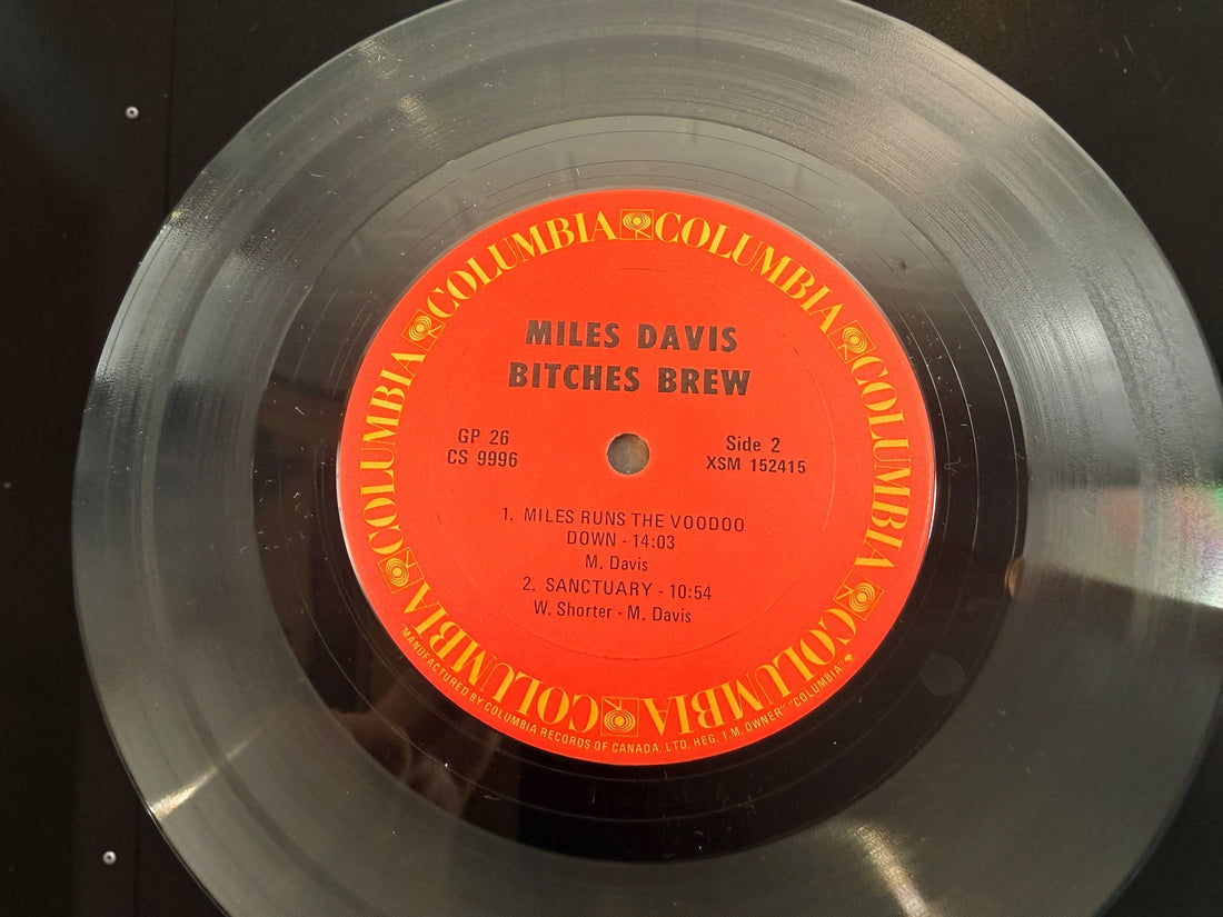 Vintage Miles Davis Bitches Brew Canadian Columbia GP 26 double vinyl LP with iconic Mati Klarwein gatefold artwork. Classic jazz fusion.