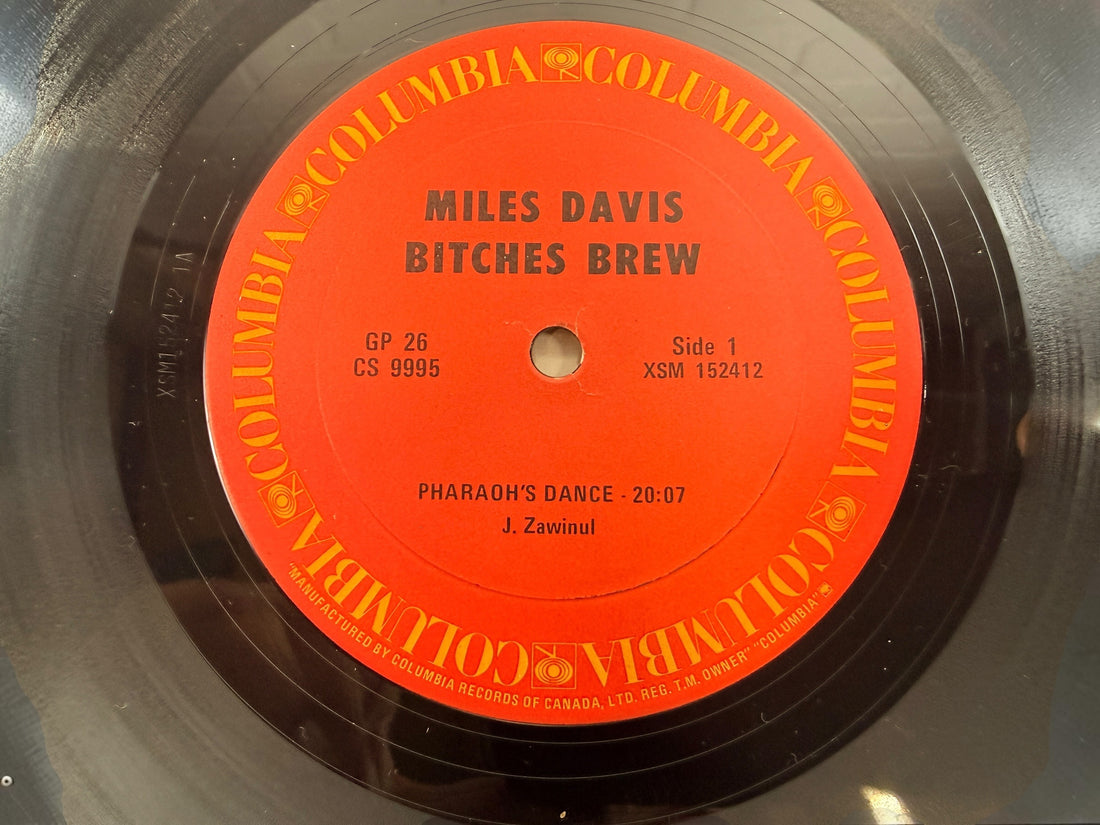 Vintage Miles Davis Bitches Brew Canadian Columbia GP 26 double vinyl LP with iconic Mati Klarwein gatefold artwork. Classic jazz fusion.