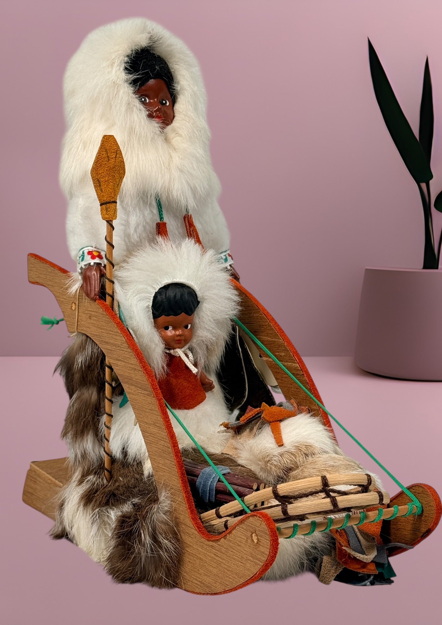 Vintage 1960s Arctic mother and child fur doll with wooden sled. Mid-century Canadiana winter décor in very good condition. Eco Depot Montreal.