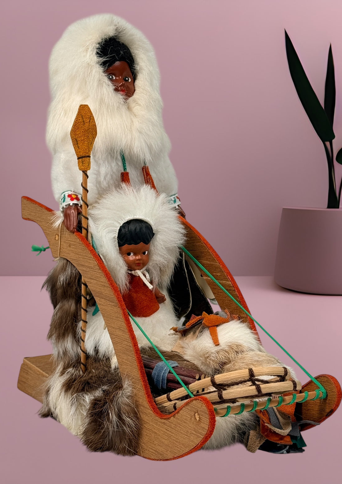 Vintage 1960s Arctic mother and child fur doll with wooden sled. Mid-century Canadiana winter décor in very good condition. Eco Depot Montreal.