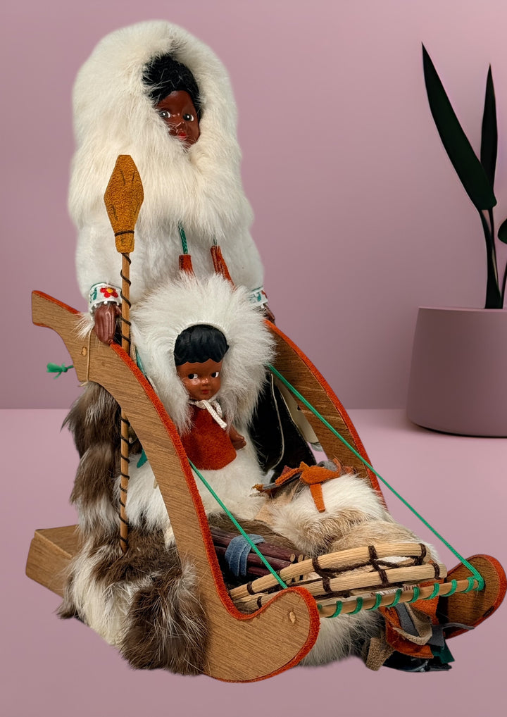 Vintage 1960s Arctic mother and child fur doll with wooden sled. Mid-century Canadiana winter décor in very good condition. Eco Depot Montreal.