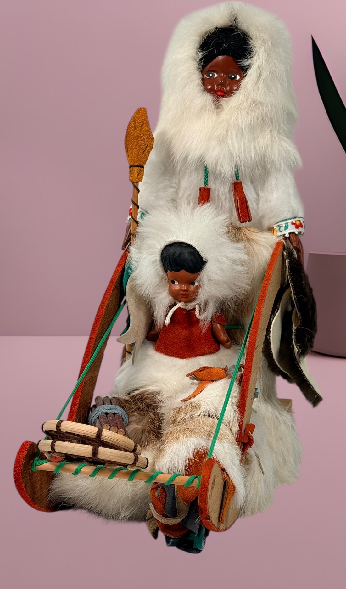 Vintage 1960s Arctic mother and child fur doll with wooden sled. Mid-century Canadiana winter décor in very good condition. Eco Depot Montreal.