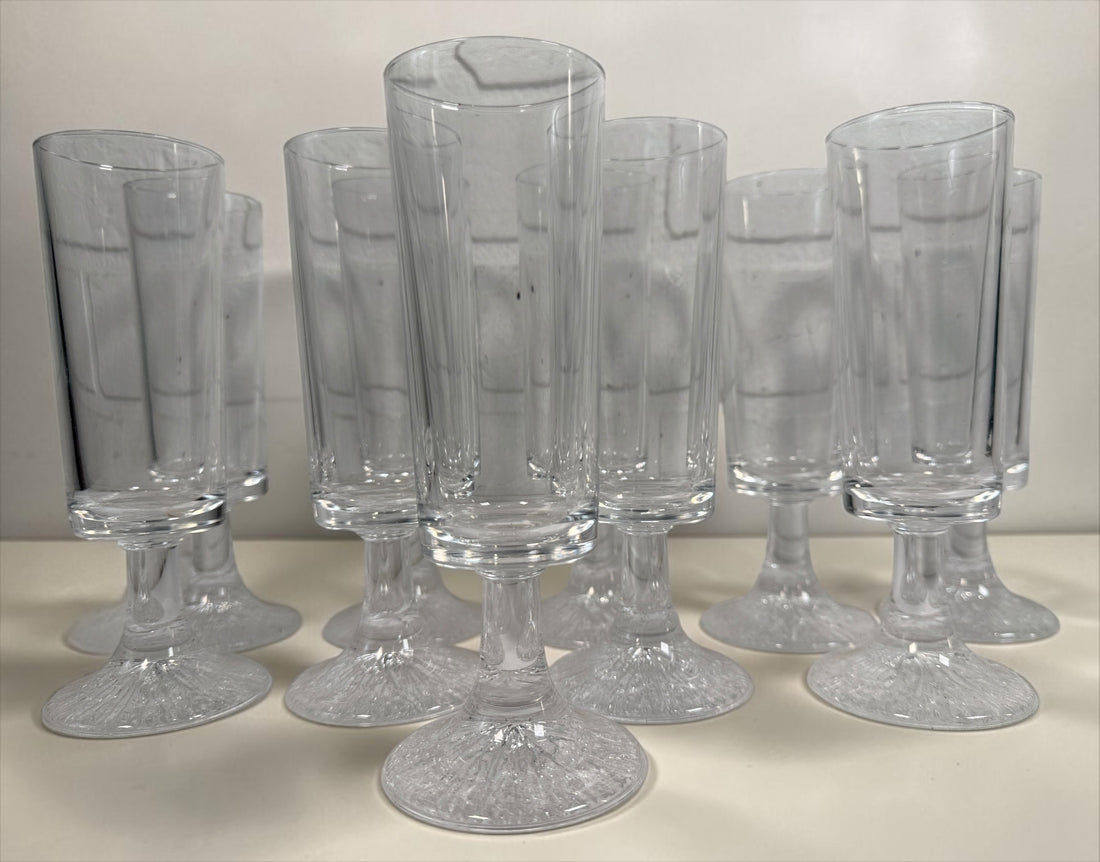 Vintage Finnish Iittala-style champagne flute with textured ice-effect base. Scandinavian Modern clear glassware, sold individually.