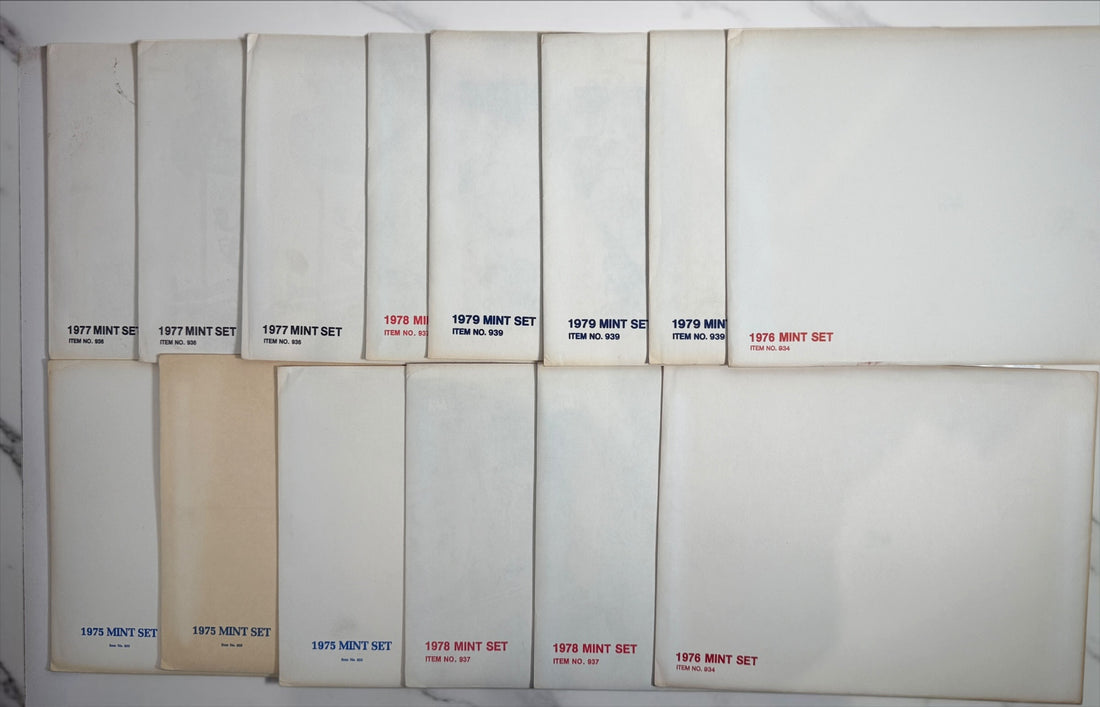 Vintage lot of 14 USPS Mint Sets of Commemorative Stamps from 1975–1979 with original stamps and presentation materials. Collectible U.S. postal history.