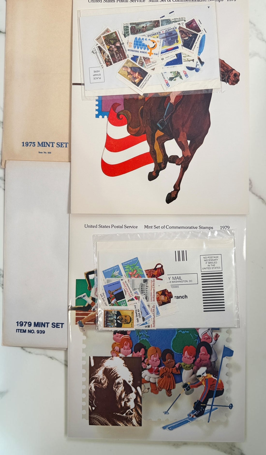 Vintage lot of 14 USPS Mint Sets of Commemorative Stamps from 1975–1979 with original stamps and presentation materials. Collectible U.S. postal history.