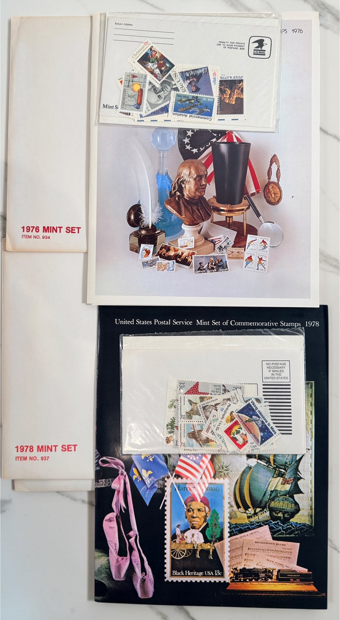 Vintage lot of 14 USPS Mint Sets of Commemorative Stamps from 1975–1979 with original stamps and presentation materials. Collectible U.S. postal history.