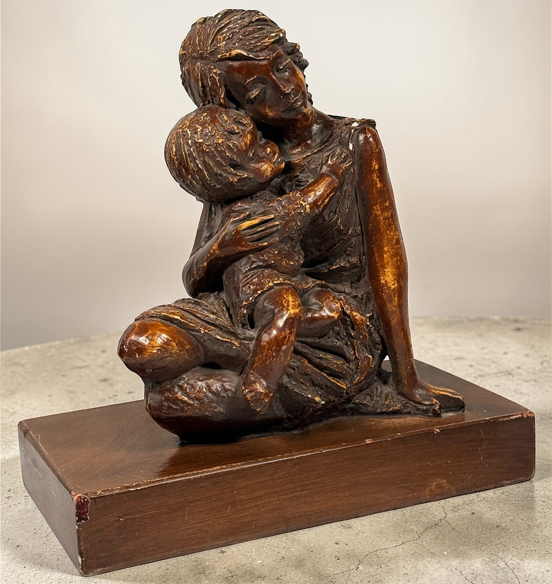 Vintage mother and child sculpture with bronze and gold finish. Modernist decorative figurine, 11.5 inches tall, ideal for mid-century or contemporary décor.