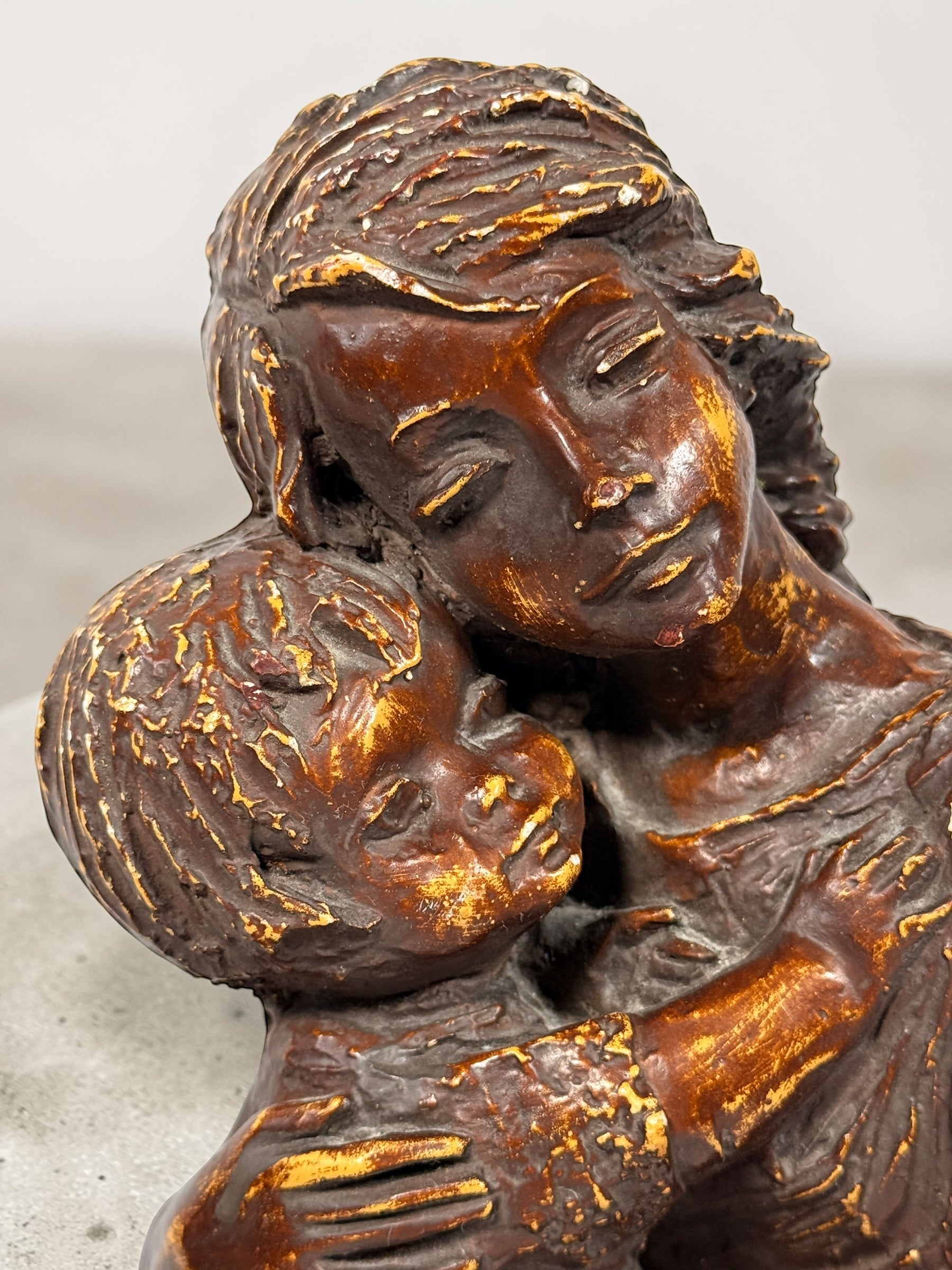 Vintage mother and child sculpture with bronze and gold finish. Modernist decorative figurine, 11.5 inches tall, ideal for mid-century or contemporary décor.