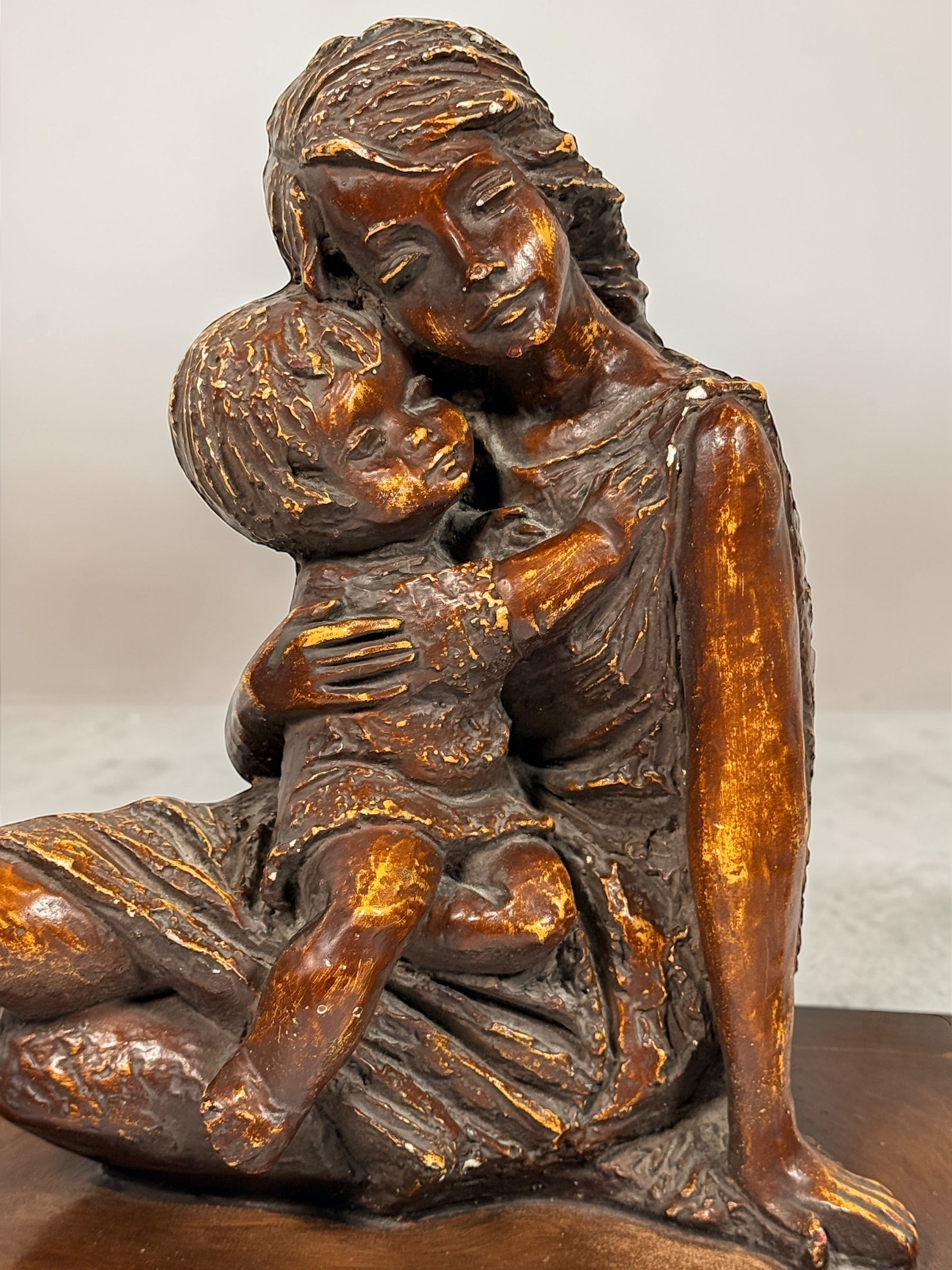 Vintage mother and child sculpture with bronze and gold finish. Modernist decorative figurine, 11.5 inches tall, ideal for mid-century or contemporary décor.