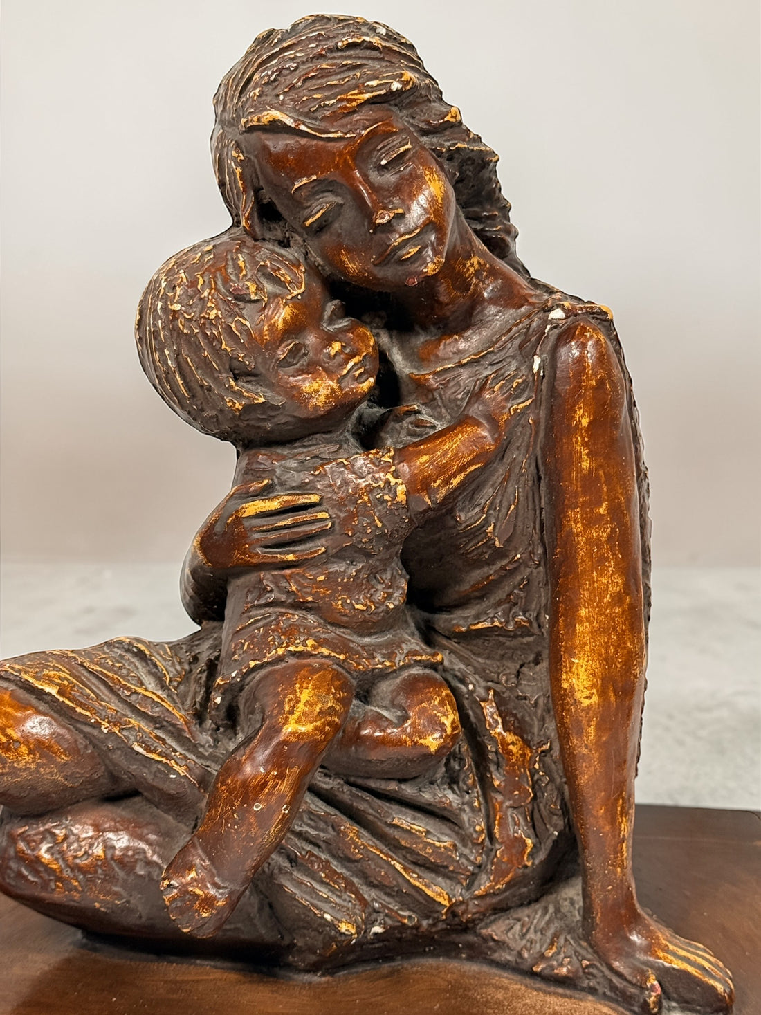 Vintage mother and child sculpture with bronze and gold finish. Modernist decorative figurine, 11.5 inches tall, ideal for mid-century or contemporary décor.