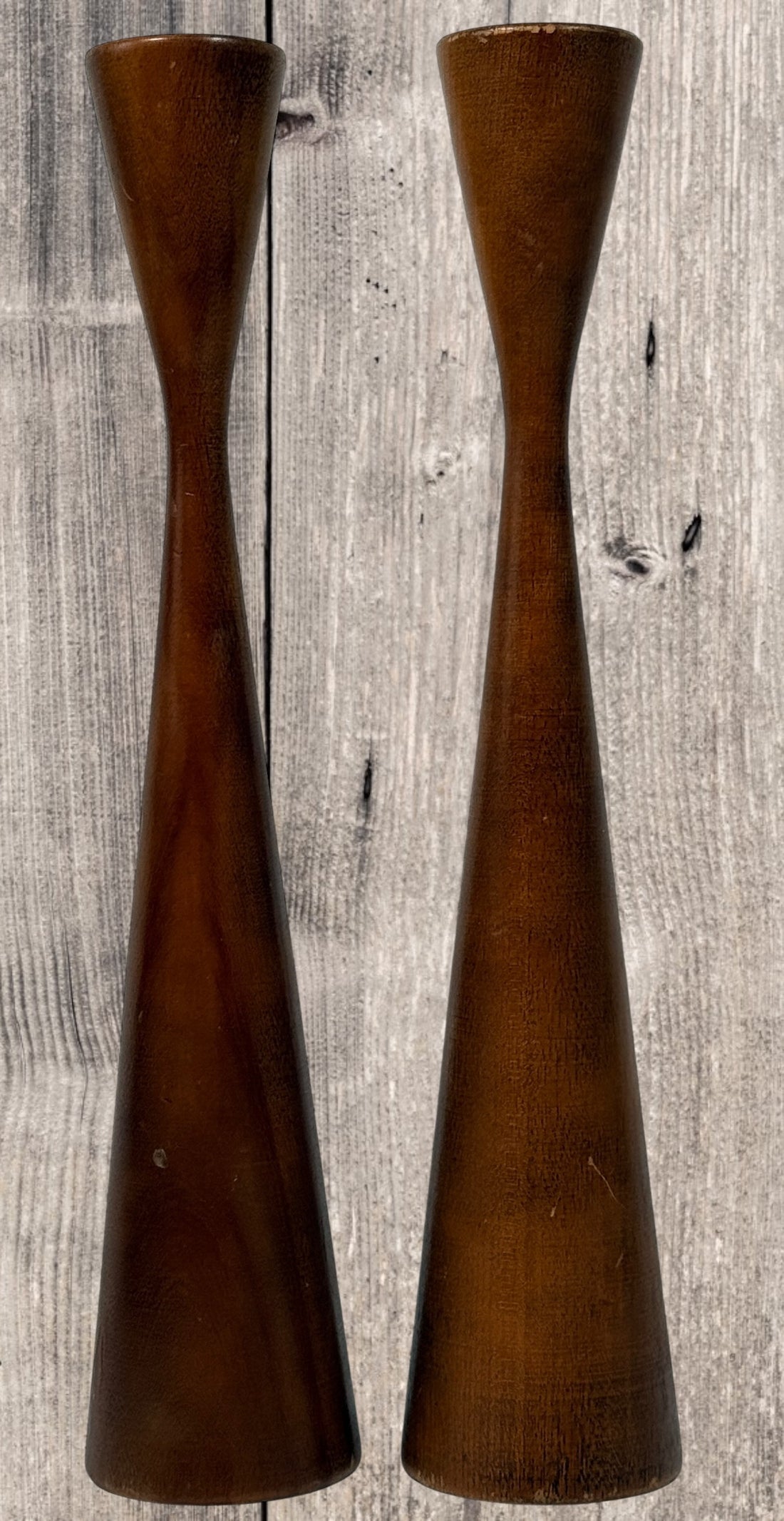 Pair of mid-century Danish modern solid teak candlesticks, Scandinavian minimalist taper candle holders with warm teak grain, perfect for vintage décor styling.