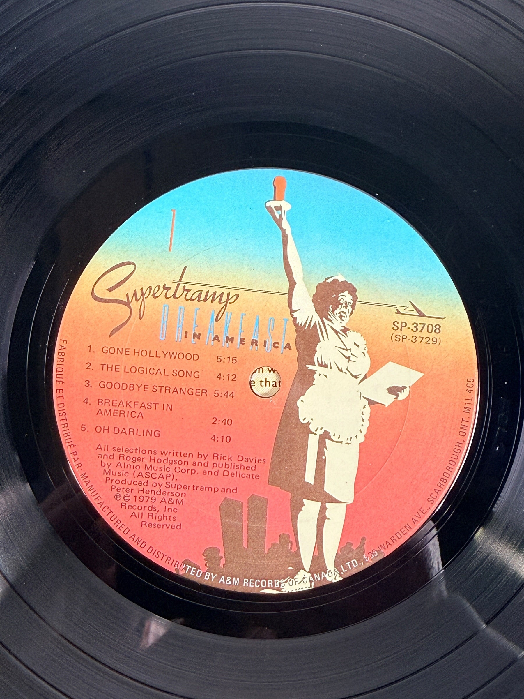 Supertramp's Breakfast in America (1979) Canadian vinyl LP on A&M Records SP-3708. Original lyric sleeve included. Vintage classic rock record.