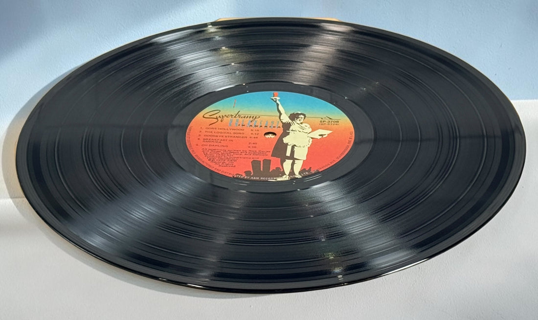 Supertramp's Breakfast in America (1979) Canadian vinyl LP on A&M Records SP-3708. Original lyric sleeve included. Vintage classic rock record.
