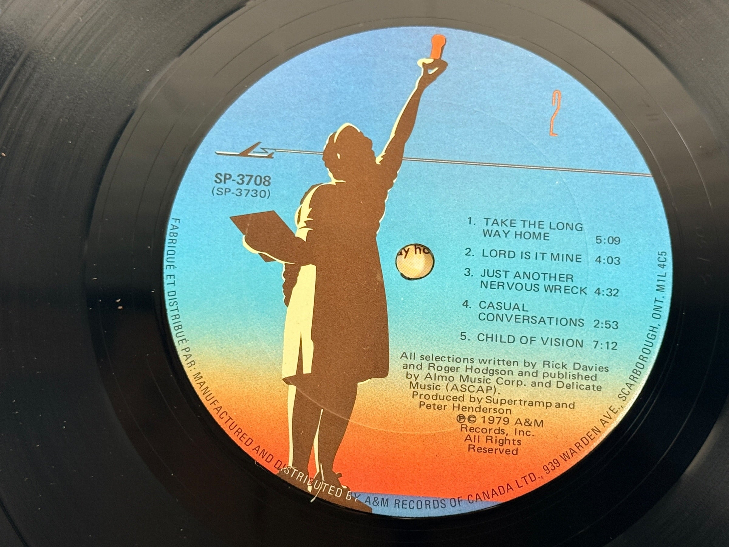 Supertramp's Breakfast in America (1979) Canadian vinyl LP on A&M Records SP-3708. Original lyric sleeve included. Vintage classic rock record.