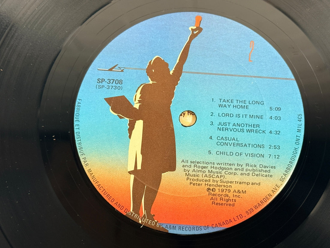 Supertramp's Breakfast in America (1979) Canadian vinyl LP on A&M Records SP-3708. Original lyric sleeve included. Vintage classic rock record.