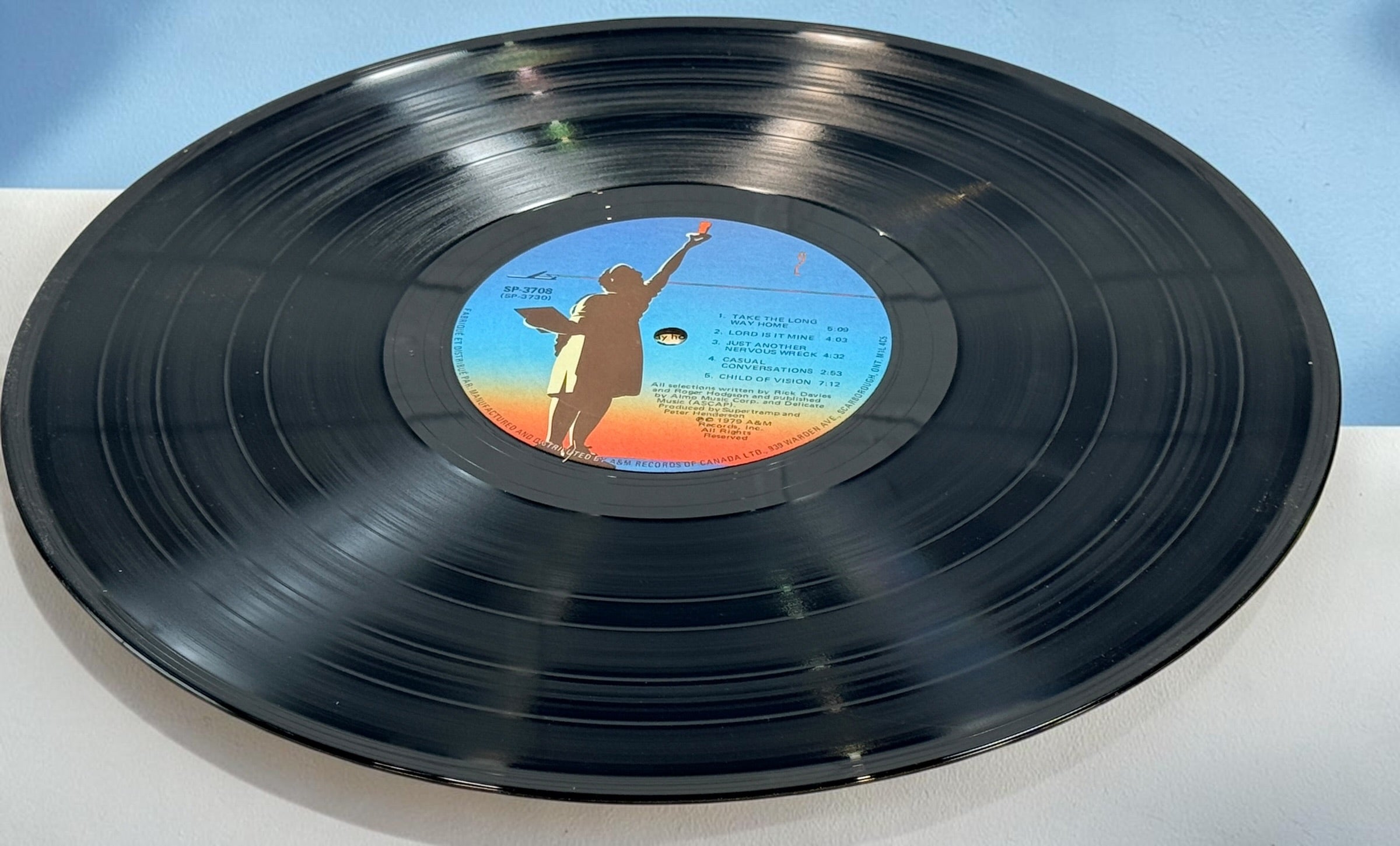 Supertramp's Breakfast in America (1979) Canadian vinyl LP on A&M Records SP-3708. Original lyric sleeve included. Vintage classic rock record.