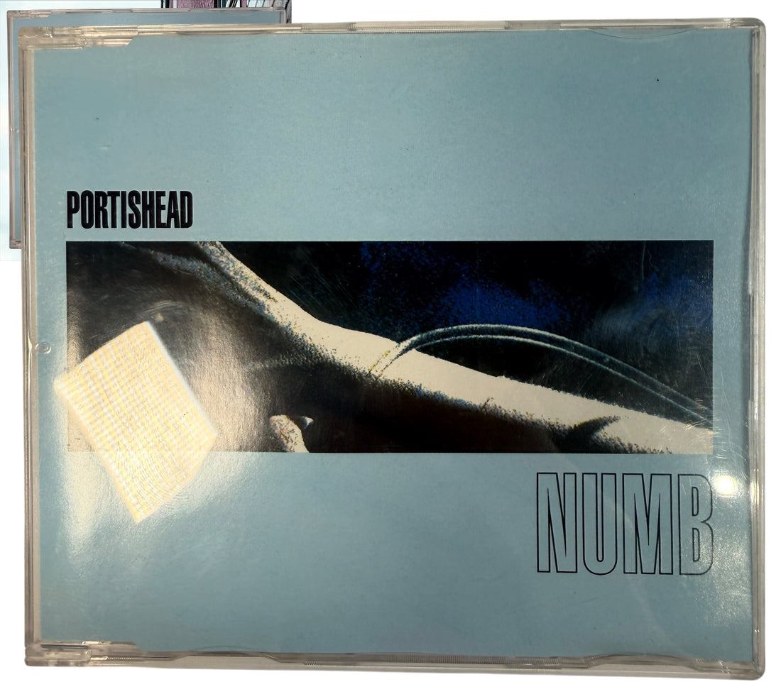 Portishead Numb 1995 European CD maxi-single with 3 live tracks. Original Go! Discs release, catalogue 850 267-2. Collectible trip-hop CD.