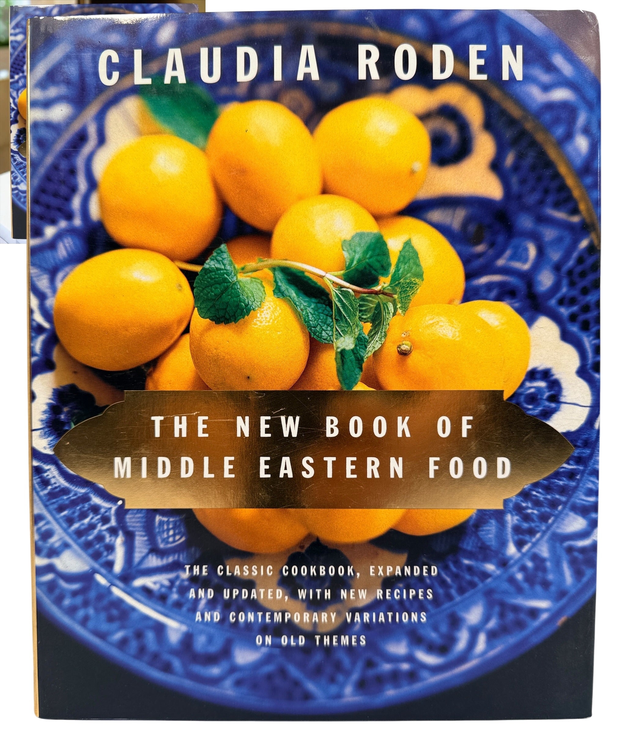 Claudia Roden's The New Book of Middle Eastern Food. Revised hardcover cookbook, 2012 printing, with traditional recipes and colour photography.