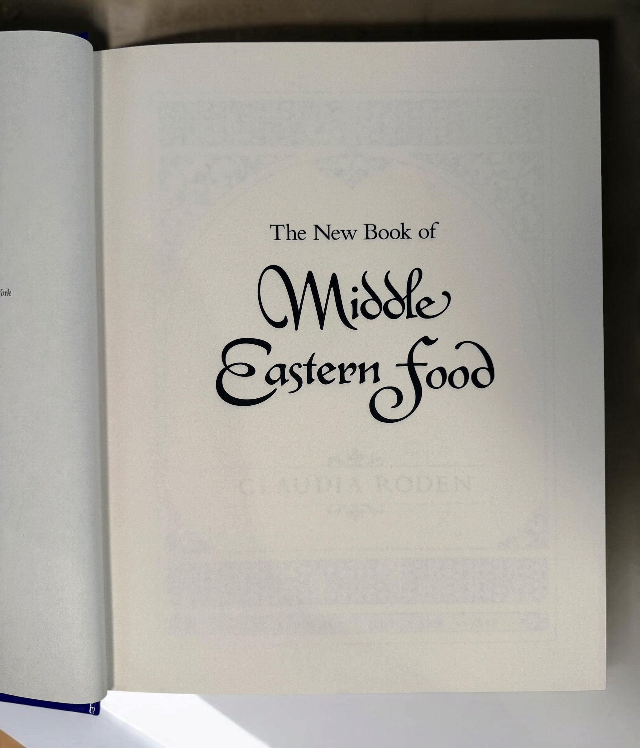 Claudia Roden's The New Book of Middle Eastern Food. Revised hardcover cookbook, 2012 printing, with traditional recipes and colour photography.