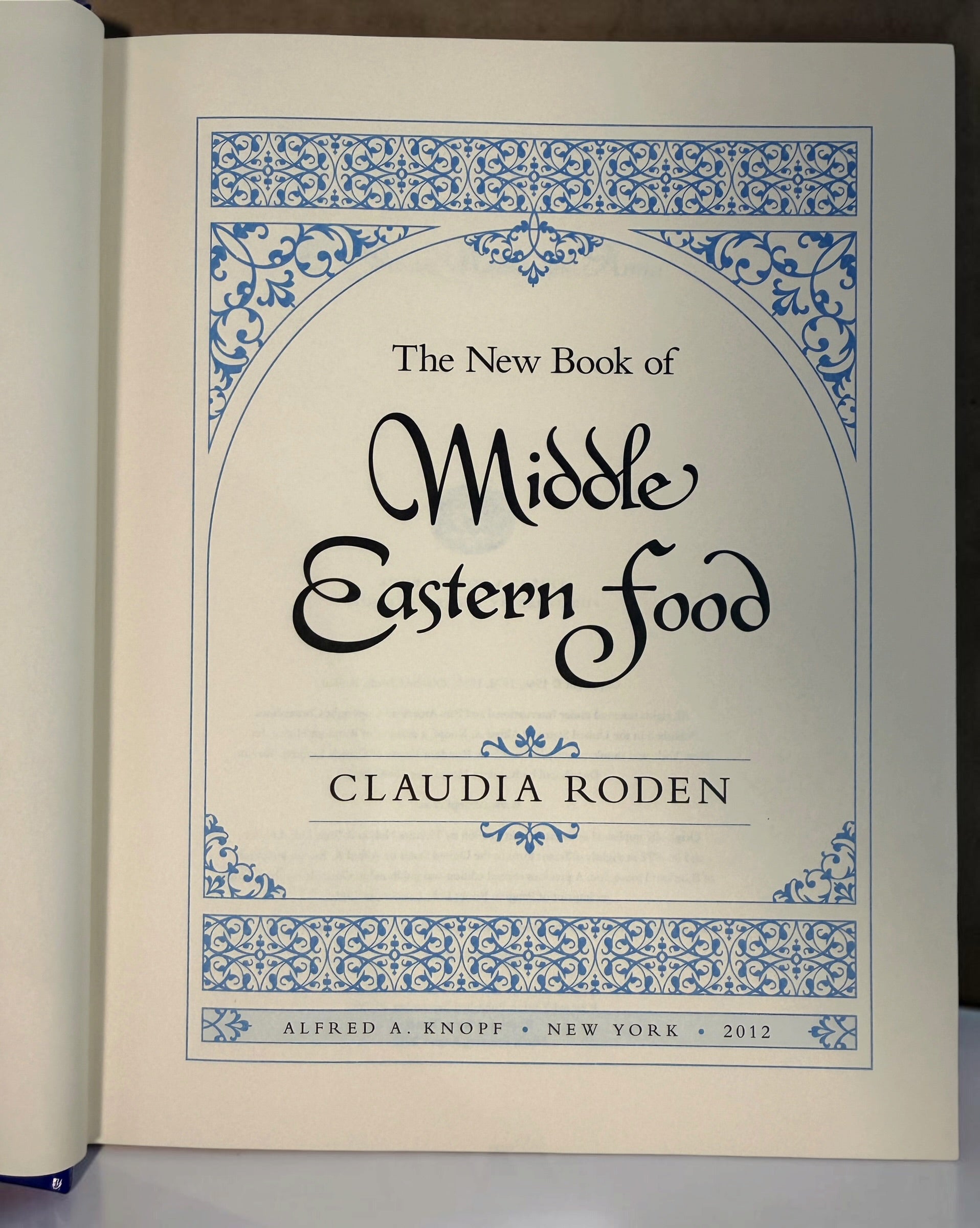 Claudia Roden's The New Book of Middle Eastern Food. Revised hardcover cookbook, 2012 printing, with traditional recipes and colour photography.