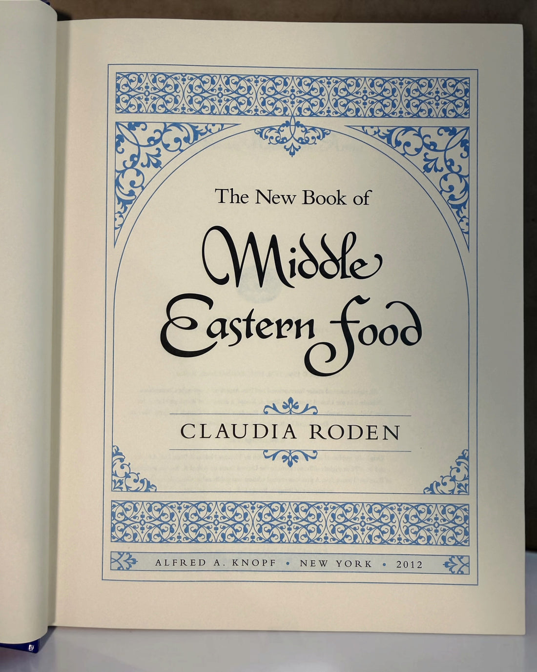 Claudia Roden's The New Book of Middle Eastern Food. Revised hardcover cookbook, 2012 printing, with traditional recipes and colour photography.