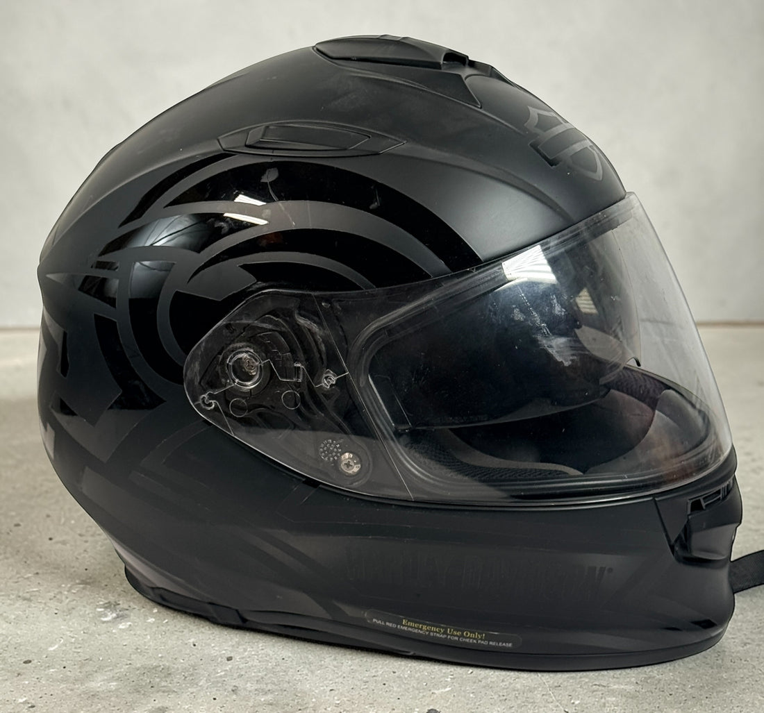Harley-Davidson HD-X03 full-face motorcycle helmet, matte black XL with clear visor and Bluetooth module. DOT certified riding helmet in very good condition.