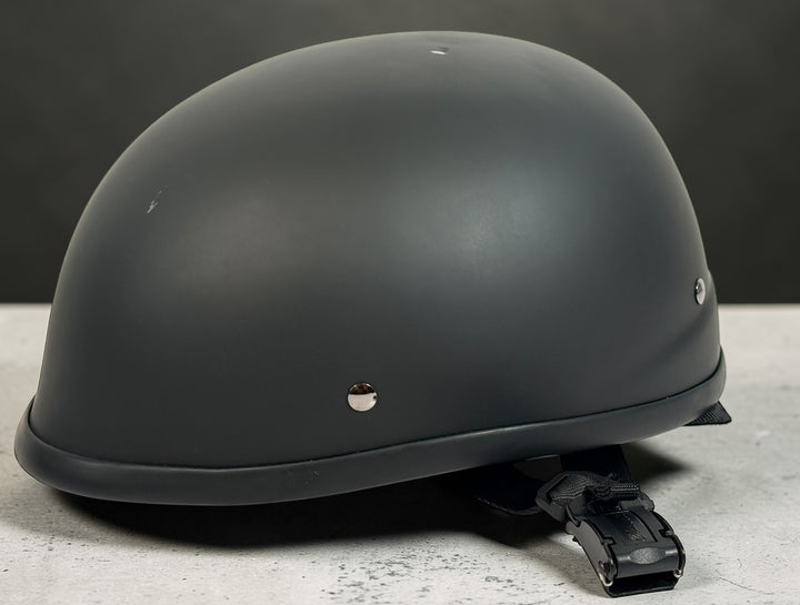 X-Terminator classic matte black motorcycle half helmet size XS with padded liner and quick release strap. Lightweight German style cruiser helmet.