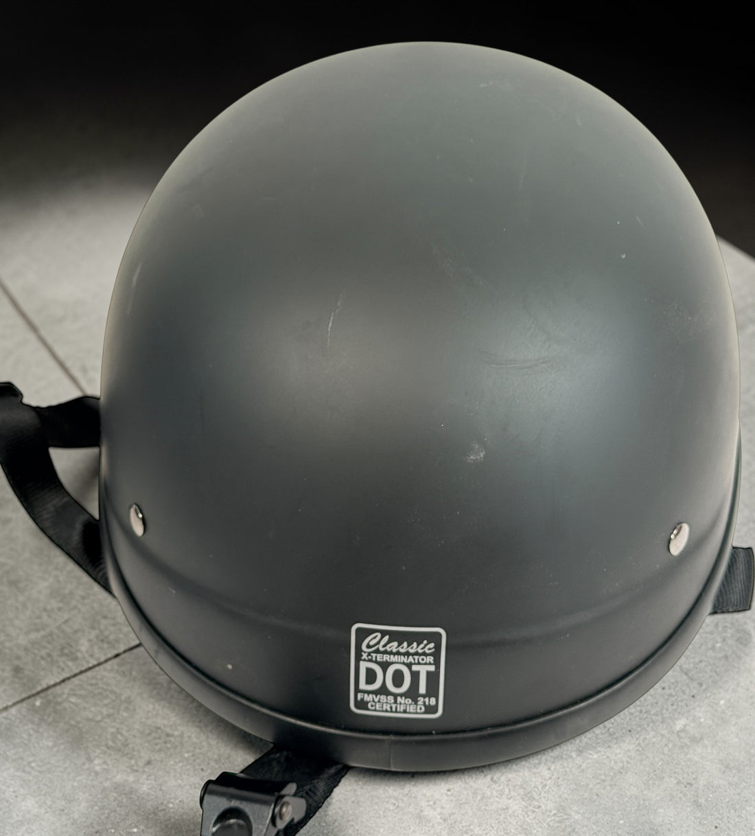 Classic X-Terminator DOT certified motorcycle half helmet size large in matte black. Cruiser style low profile helmet with quick release strap in good condition.