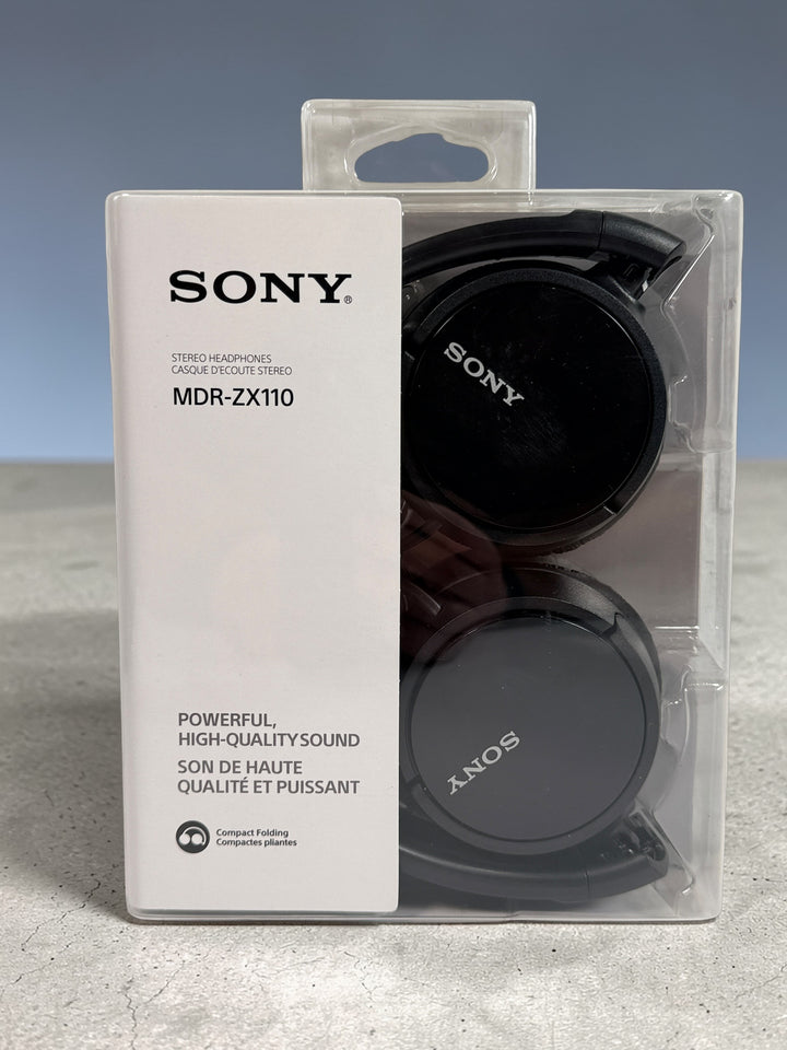 Sony MDR-ZX110 wired stereo headphones in black. Compact folding design with 3.5mm jack. Lightweight portable Sony headphones new in original packaging.