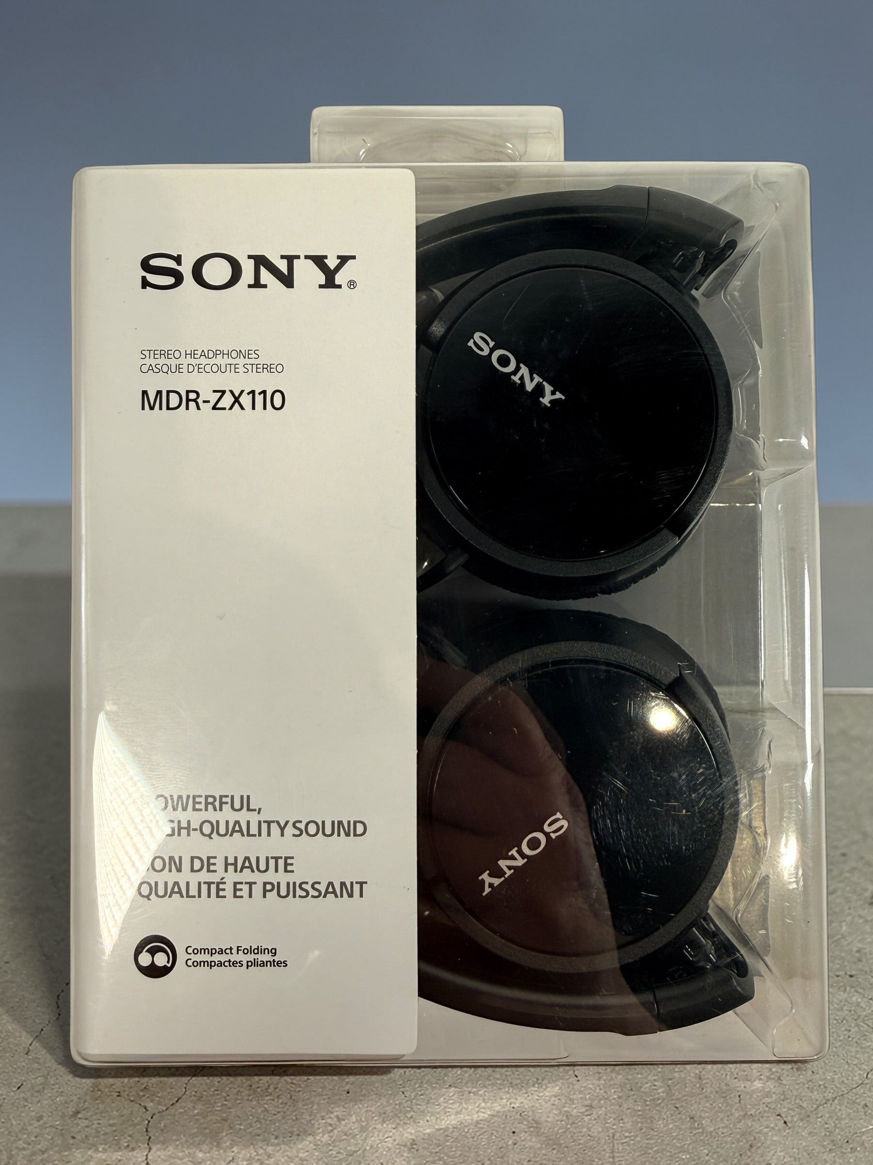 Sony MDR-ZX110 wired stereo headphones in black. Compact folding design with 3.5mm jack. Lightweight portable Sony headphones new in original packaging.