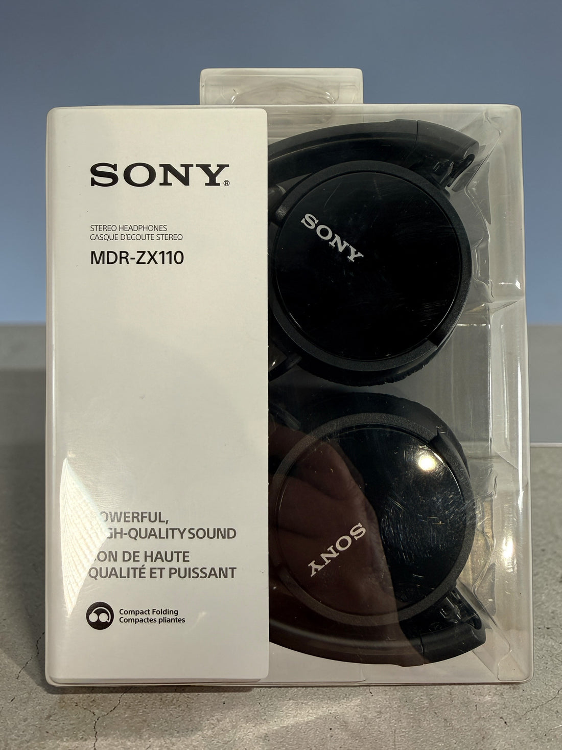 Sony MDR-ZX110 wired stereo headphones in black. Compact folding design with 3.5mm jack. Lightweight portable Sony headphones new in original packaging.