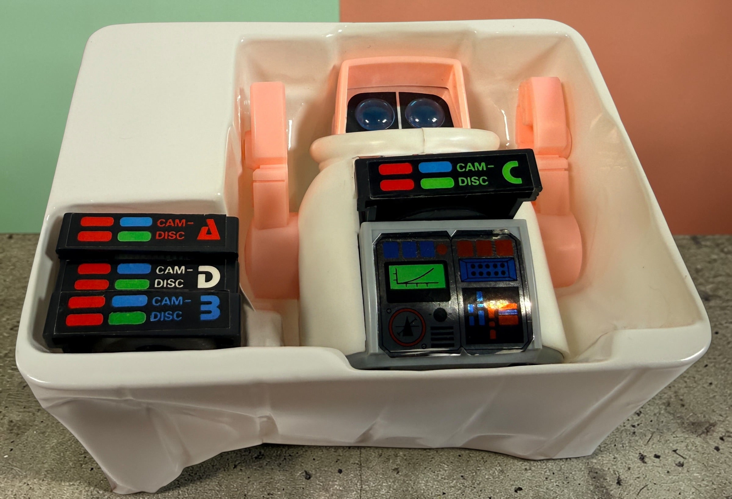 Vintage 1980s Disc Bot programmable toy robot with Disc Cam cartridges and original box. Battery operated retro robot toy made in Hong Kong.