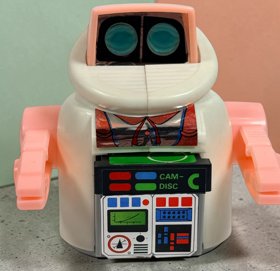 Vintage 1980s Disc Bot programmable toy robot with Disc Cam cartridges and original box. Battery operated retro robot toy made in Hong Kong.