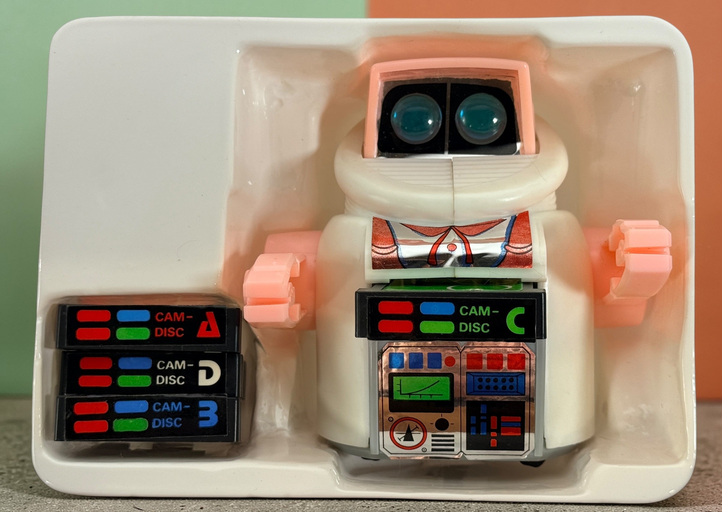 Vintage 1980s Disc Bot programmable toy robot with Disc Cam cartridges and original box. Battery operated retro robot toy made in Hong Kong.