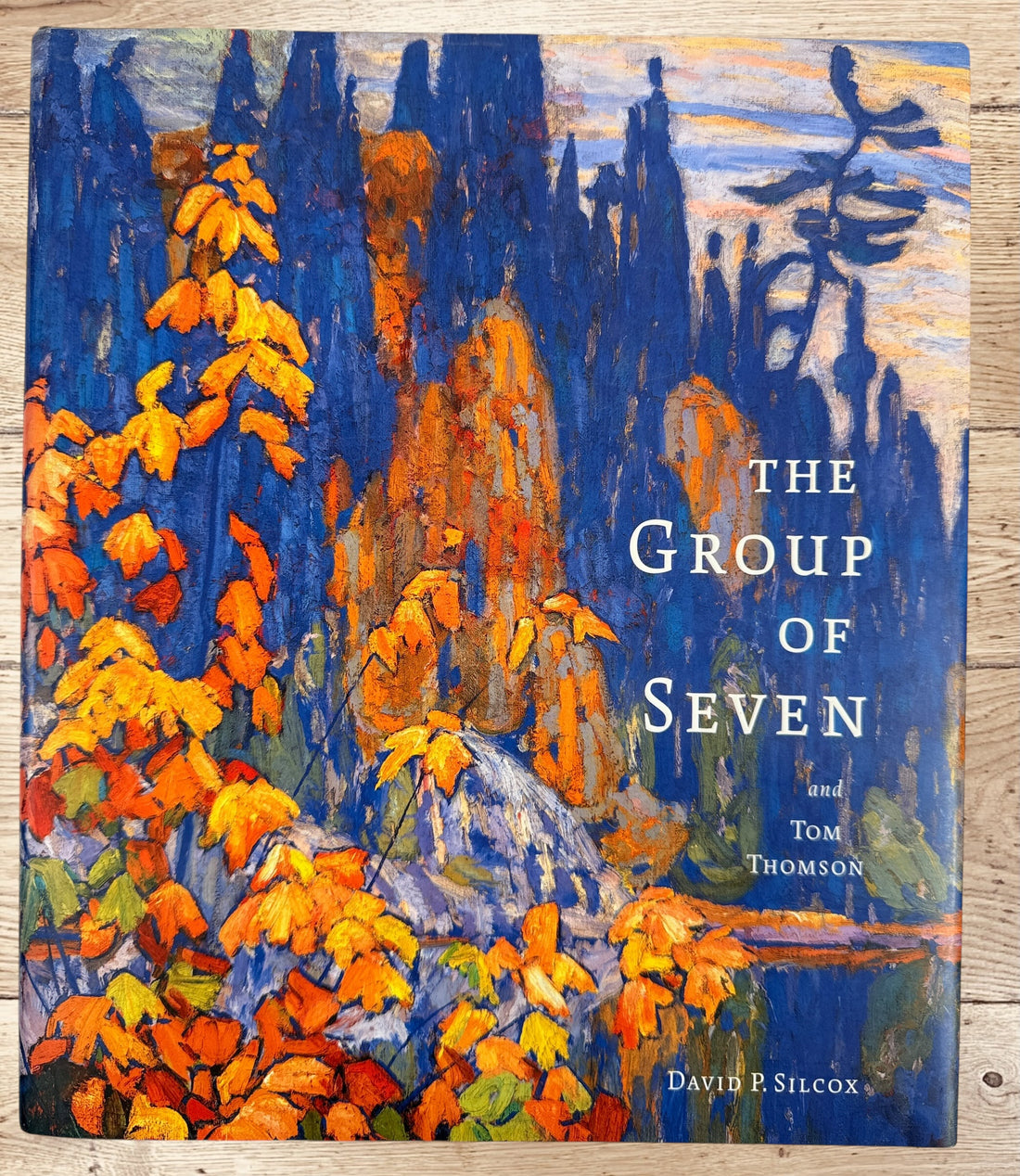 Large hardcover art book on the Group of Seven and Tom Thomson by David P. Silcox featuring 400 color reproductions of iconic Canadian landscape paintings.