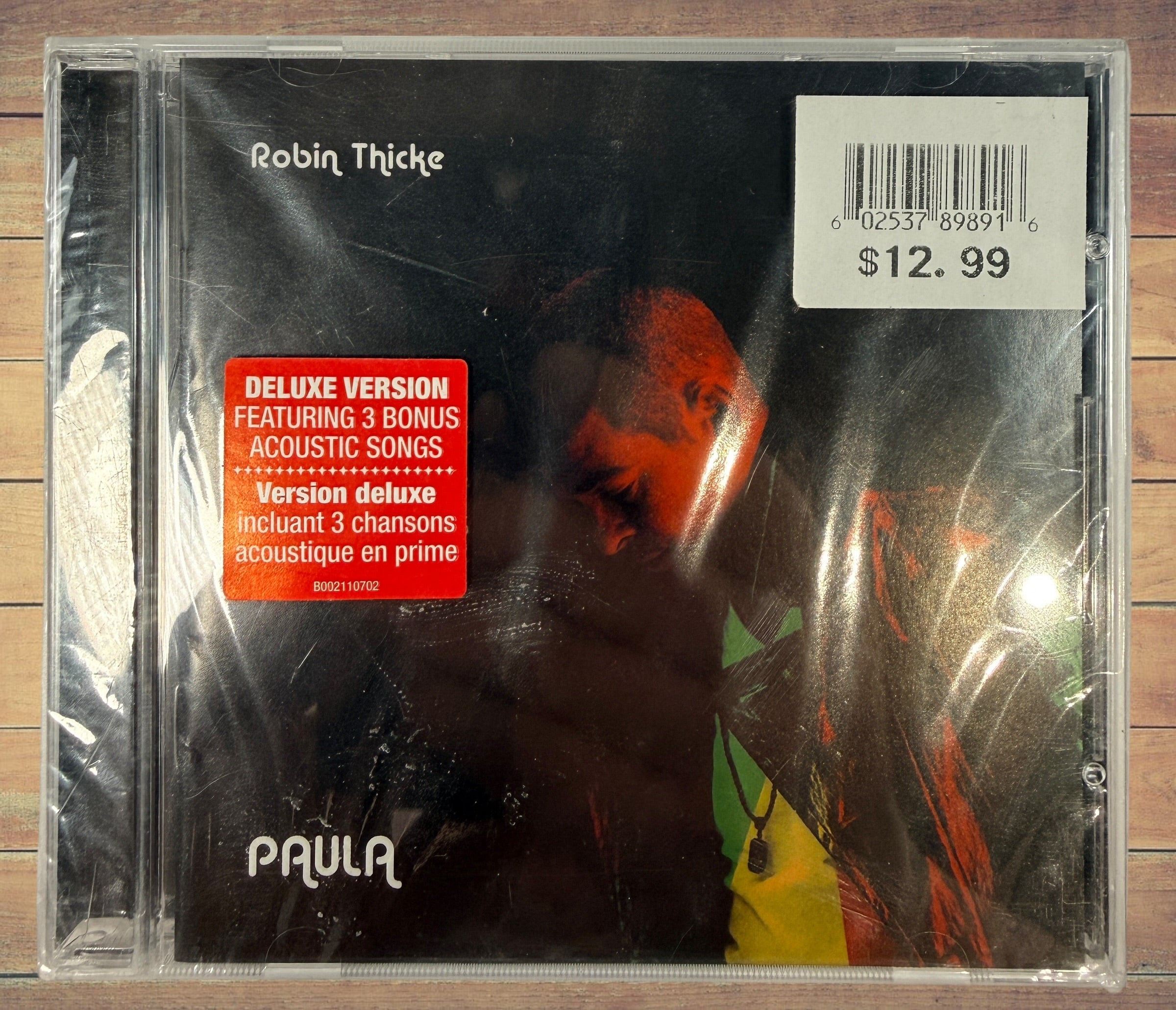 Sealed deluxe CD edition of Robin Thicke’s 2014 album Paula featuring three acoustic bonus tracks. Original retail copy in shrink wrap with jewel case.