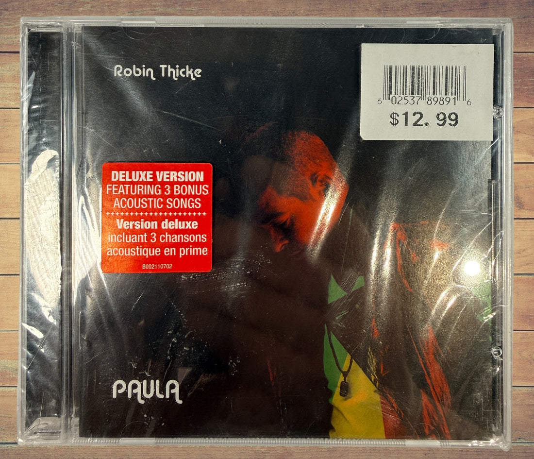 Sealed deluxe CD edition of Robin Thicke’s 2014 album Paula featuring three acoustic bonus tracks. Original retail copy in shrink wrap with jewel case.