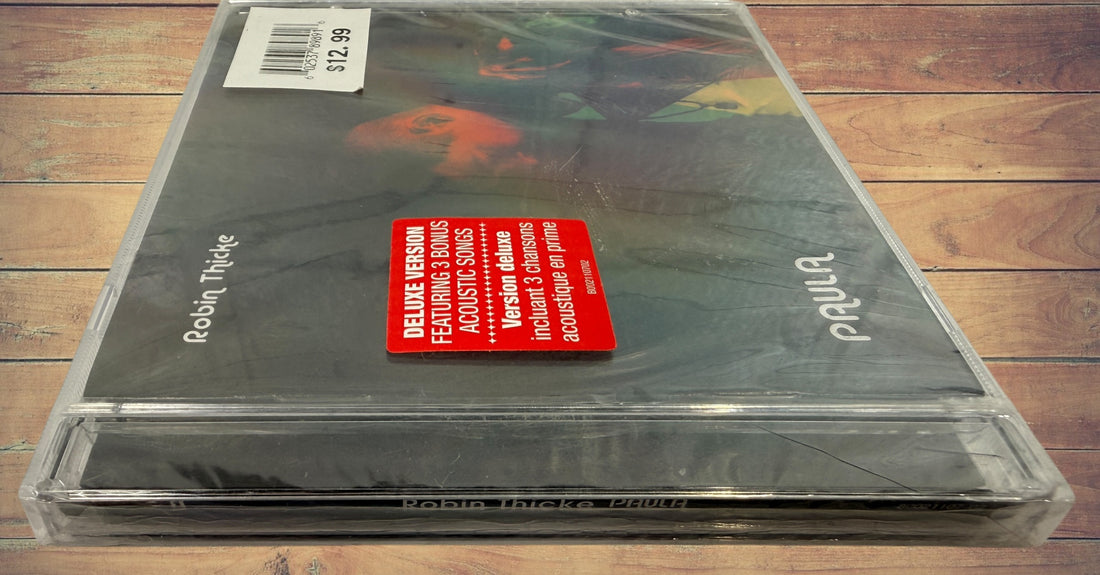 Sealed deluxe CD edition of Robin Thicke’s 2014 album Paula featuring three acoustic bonus tracks. Original retail copy in shrink wrap with jewel case.