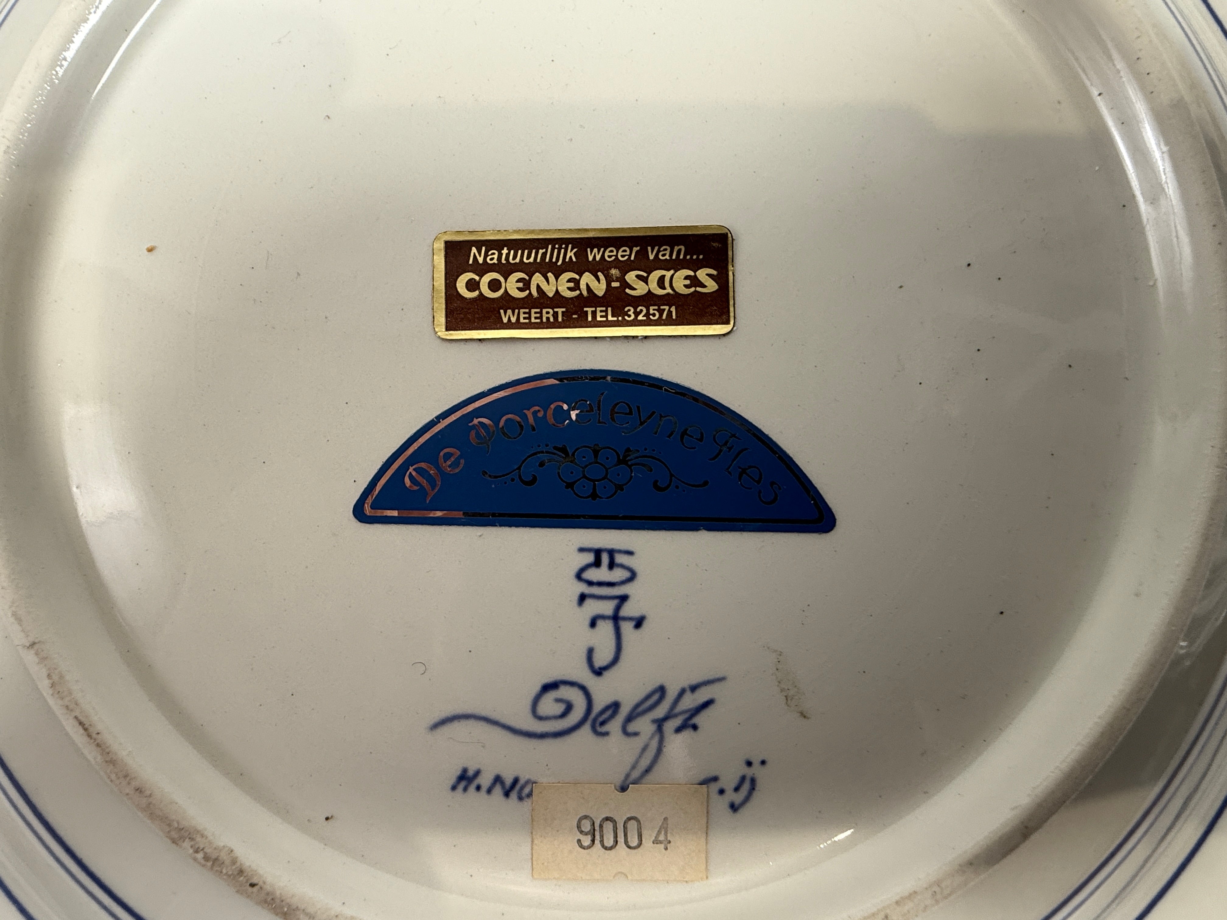 Ceramic dish with Coenen & Sibies branding and signature on the base