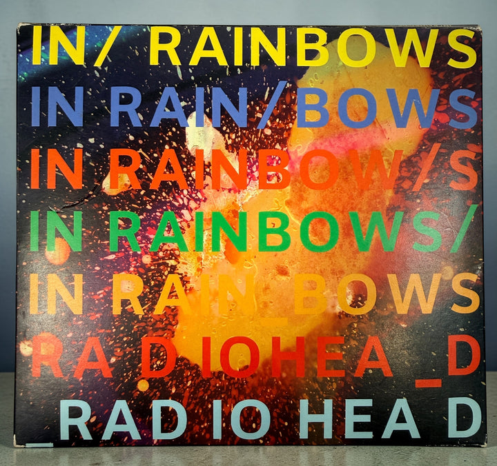 Radiohead In Rainbows CD 2008 complete with slipcase and inserts. Iconic alternative rock album in very good condition. Ships quickly from Canada.