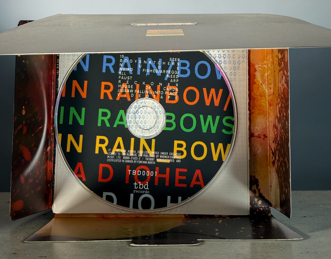 Radiohead In Rainbows CD 2008 complete with slipcase and inserts. Iconic alternative rock album in very good condition. Ships quickly from Canada.