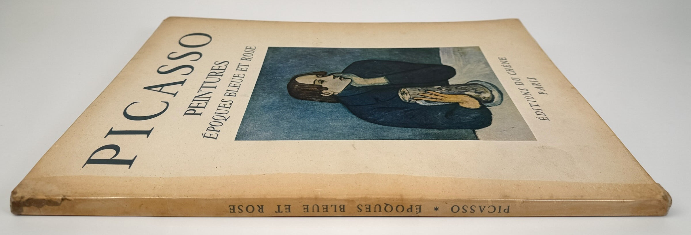1955 Picasso art book with Blue and Rose period plates. French edition from Éditions du Chêne. Vintage decorative art book with full-page reproductions.
