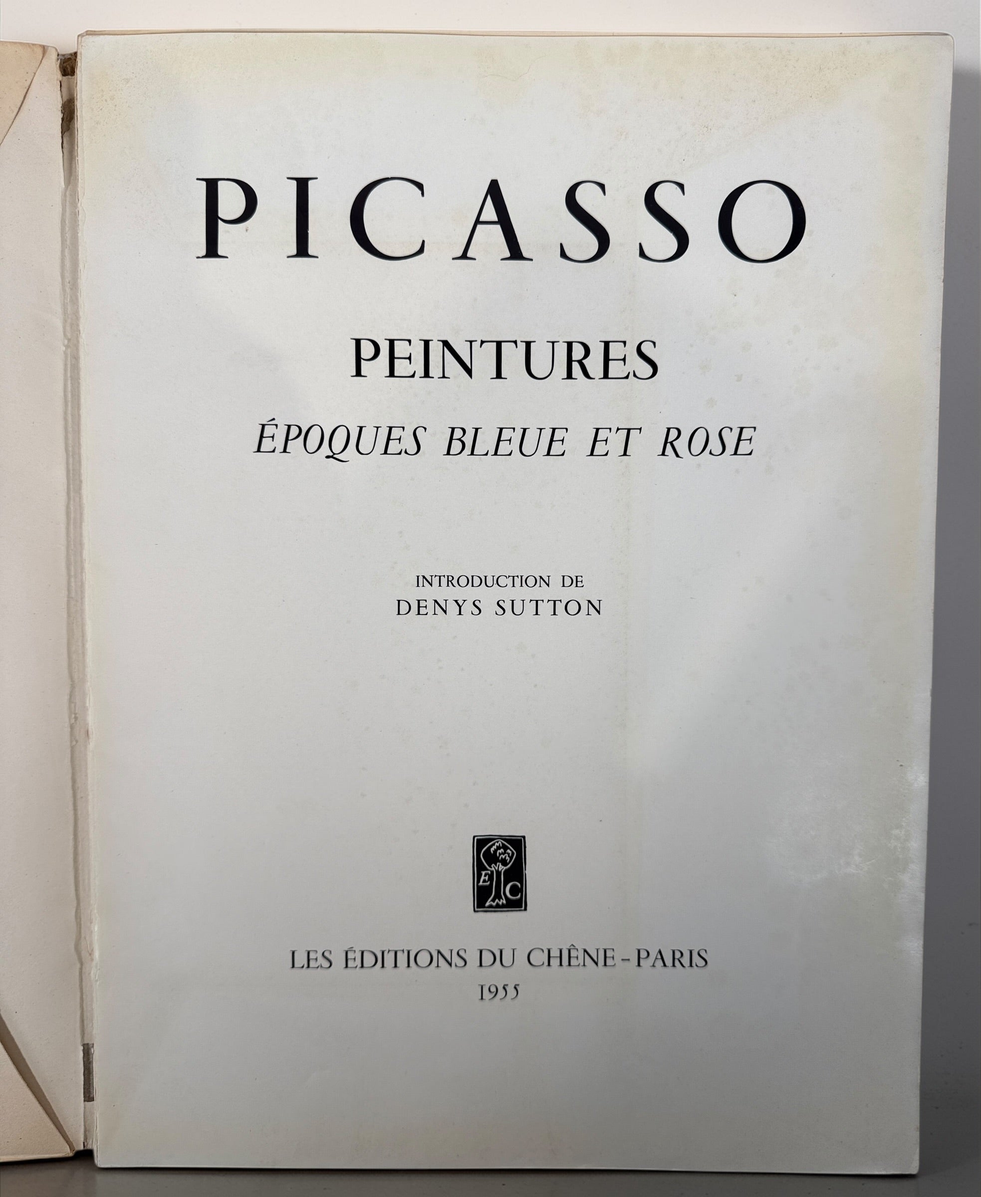 1955 Picasso art book with Blue and Rose period plates. French edition from Éditions du Chêne. Vintage decorative art book with full-page reproductions.