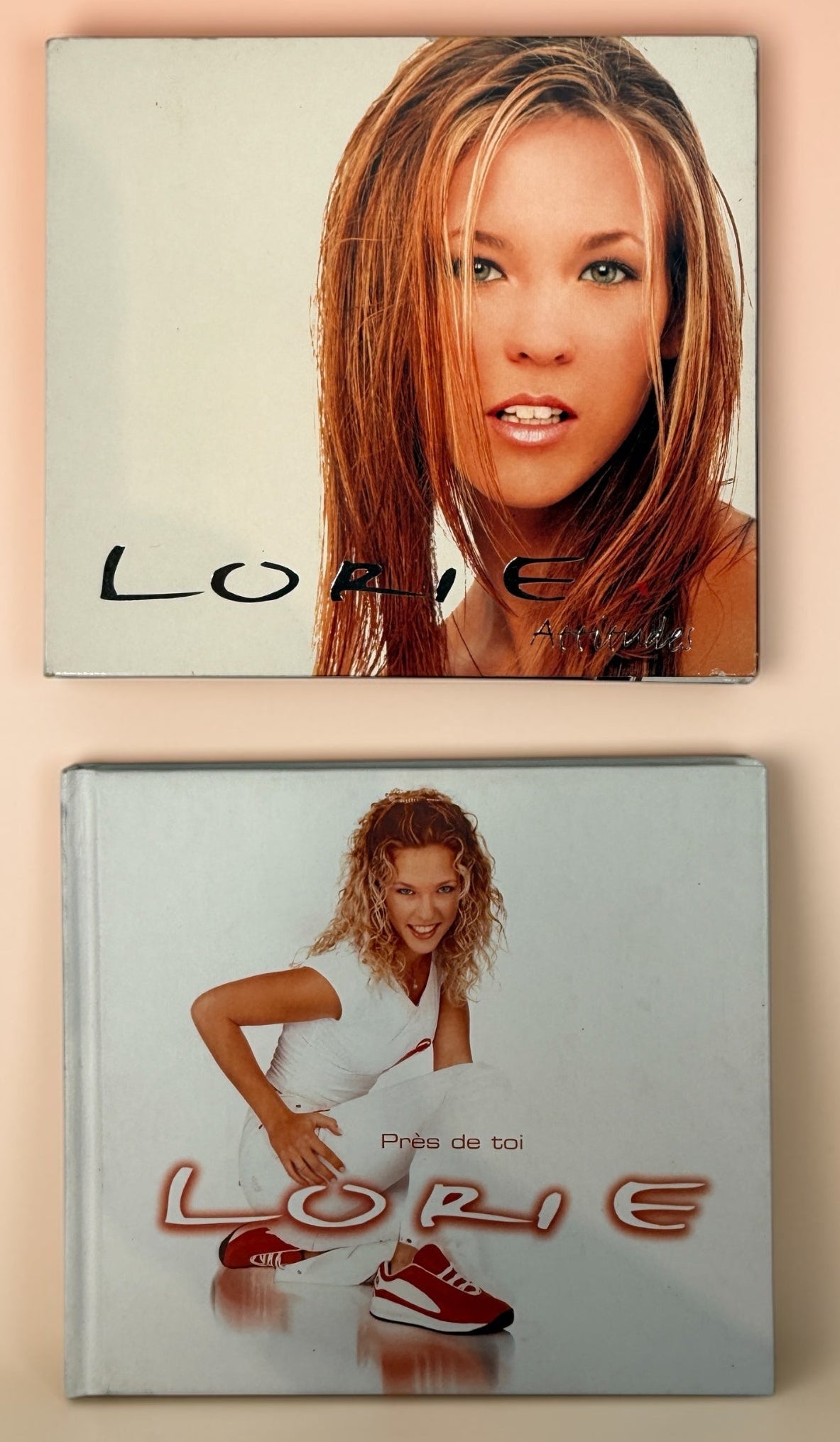 Two album covers featuring a person with 'Lorie' branding on a beige background