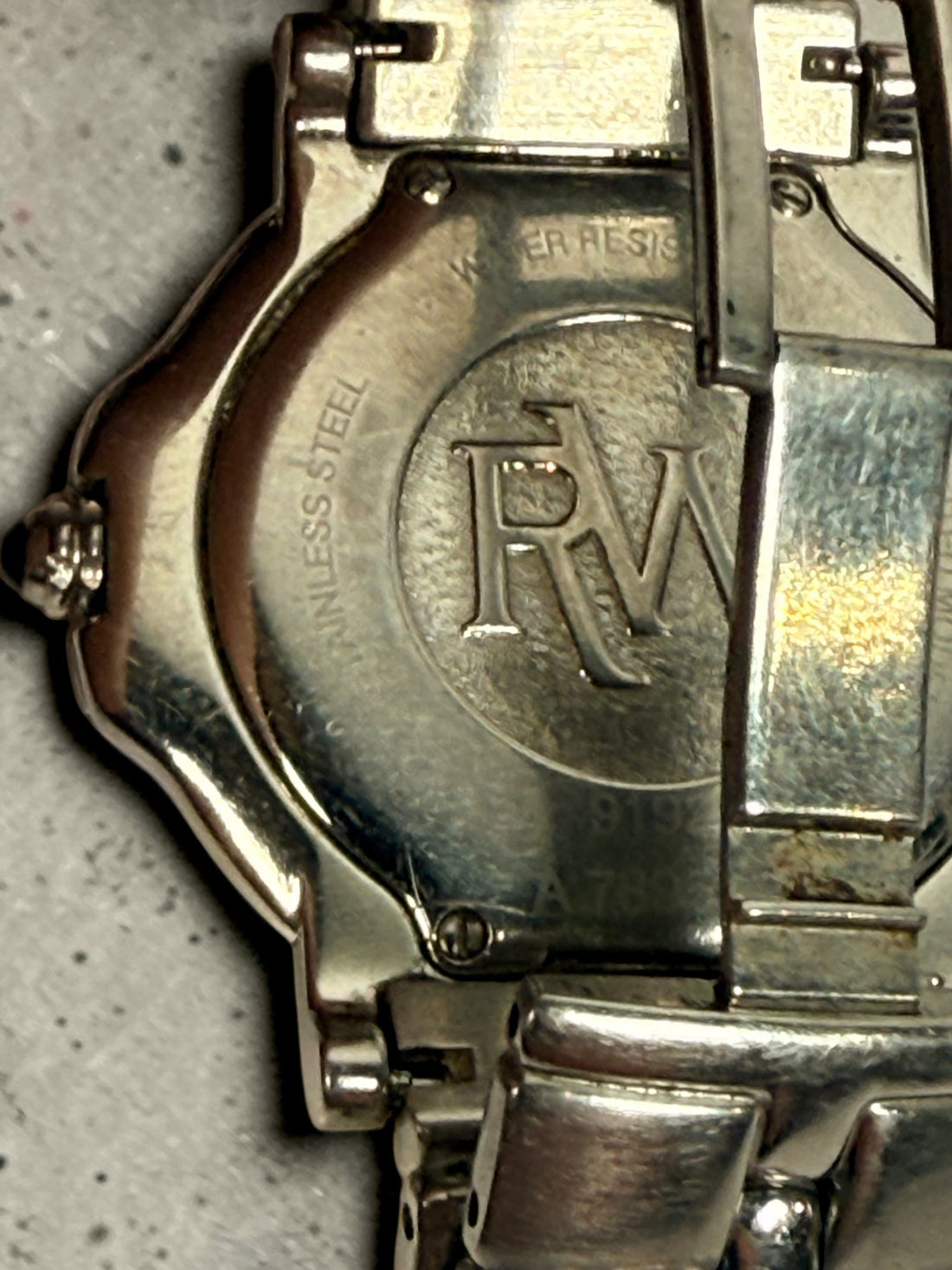 Raymond Weil Parsifal Swiss quartz watch with black dial, Roman numerals, and steel bracelet. Classic luxury design with date display, everyday wearable style.