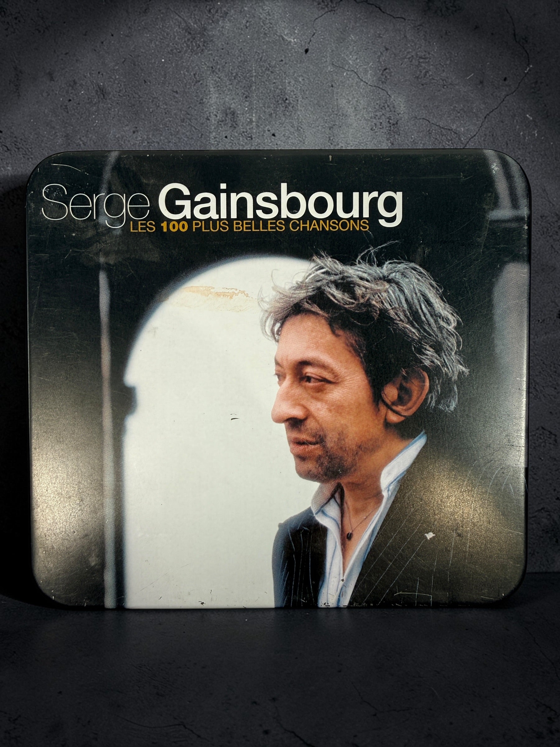 Serge Gainsbourg 5 CD box set Les 100 Plus Belles Chansons in collectible tin case. Complete French compilation with iconic tracks, great condition.
