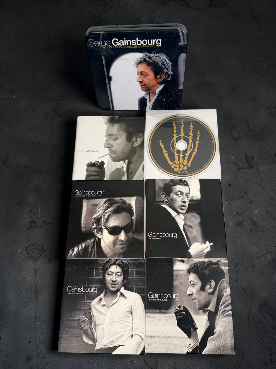 Serge Gainsbourg 5 CD box set Les 100 Plus Belles Chansons in collectible tin case. Complete French compilation with iconic tracks, great condition.