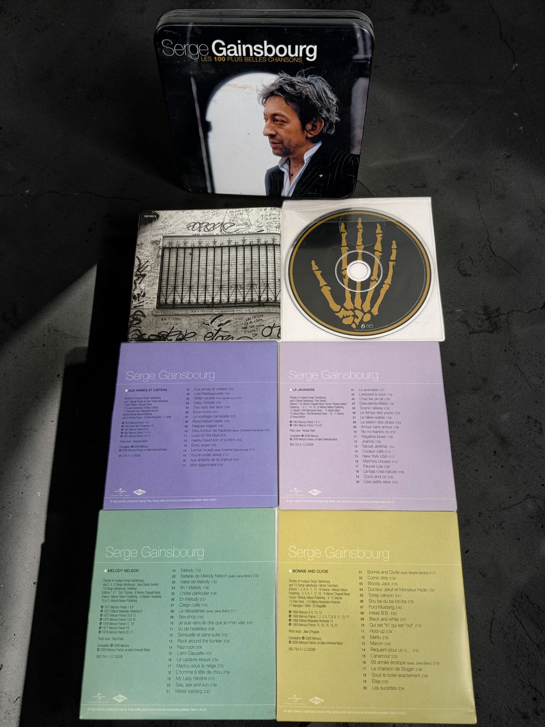 Serge Gainsbourg 5 CD box set Les 100 Plus Belles Chansons in collectible tin case. Complete French compilation with iconic tracks, great condition.